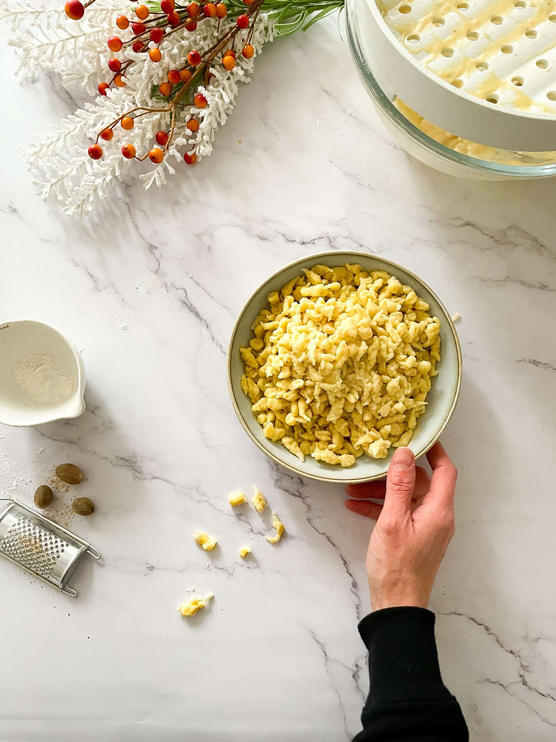 12 Easy Swiss Recipes You Can Try at Home 5 Spaetzle (Swiss egg noodles) being served in a bowl.