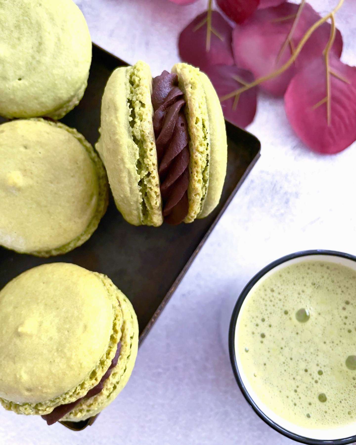 Matcha macarons with chocolate ganache filling.