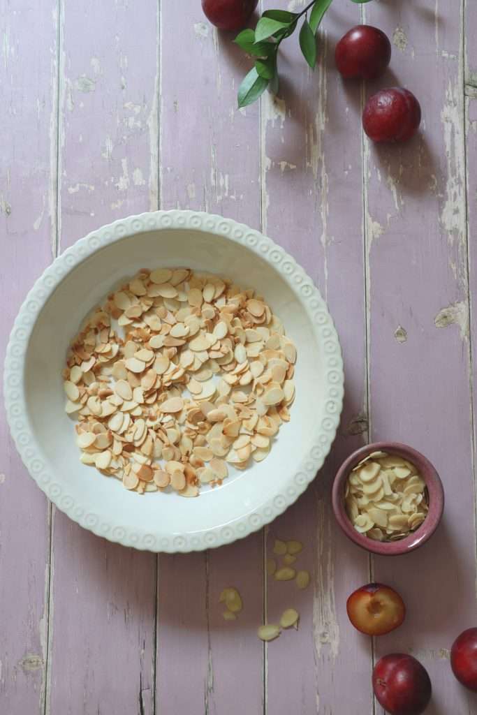 Swiss Plum Meringue (Zwetschgen) with Toasted Almond Base 5 Toasted almonds placed as the base for Swiss plum meringue recipe.