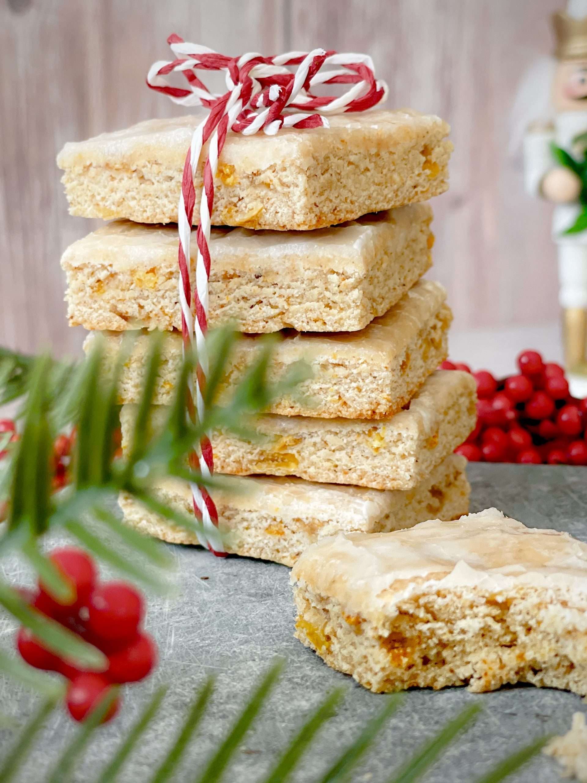 Basler Läckerli (Traditional Swiss Honey Spice Cookies) 23 Swiss Basler Lakerli cookies in a stack with a red and white string wrapped around the bundle.