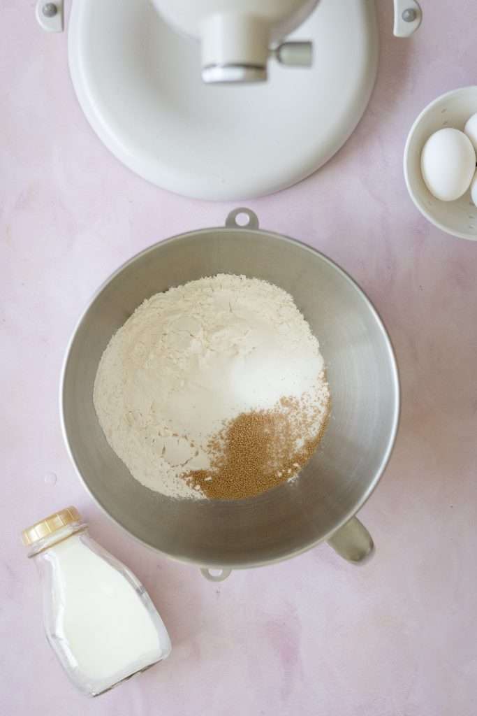 Strawberry Rhubarb Brioche Buns with Baked Vanilla Cream 21 Dry ingredients for strawberry rhubarb brioche buns in a large mixing bowl.