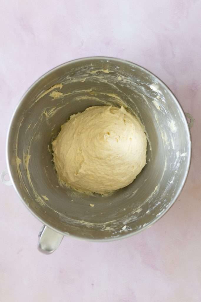Strawberry Rhubarb Brioche Buns with Baked Vanilla Cream 23 Soft brioche dough in a large silver mixing bowl.