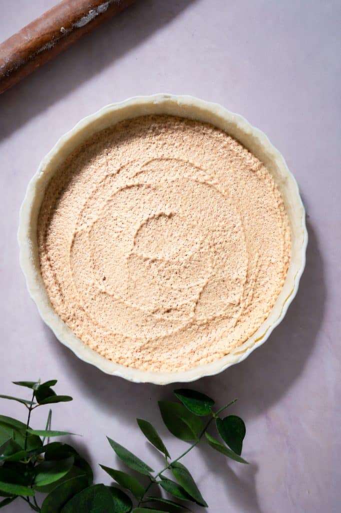 Hazelnut frangipane spread in the bottom of the pie crust before adding the strawberry rhubarb filling.