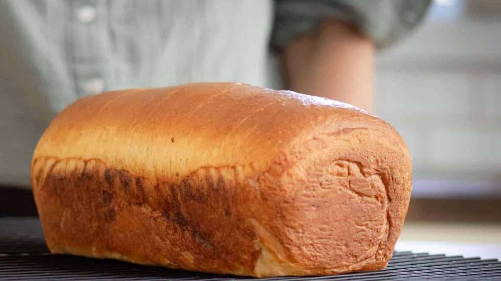 Maple Brioche with a Maple Sugar Swirl 3 Freshly baked maple brioche on a counter.
